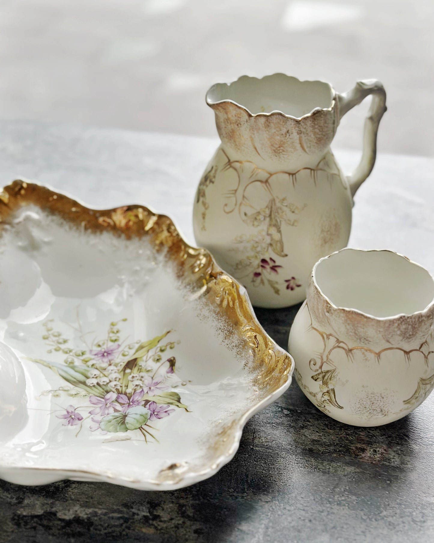 Antique handpainted lily of the valley water jug and milk jug set