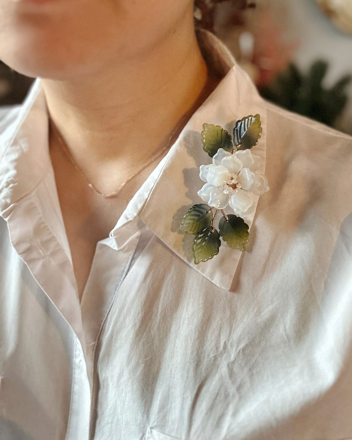 The new peony collar brooch in milky white