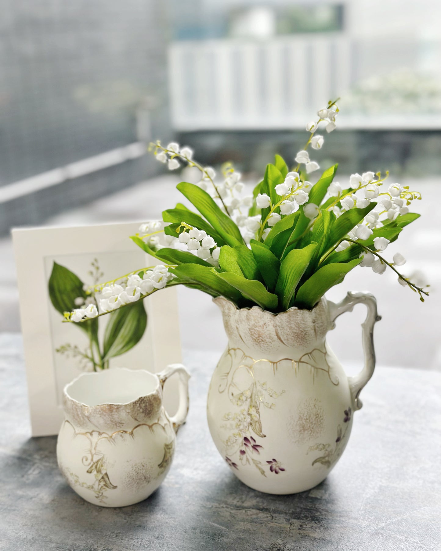 Antique handpainted lily of the valley water jug and milk jug set