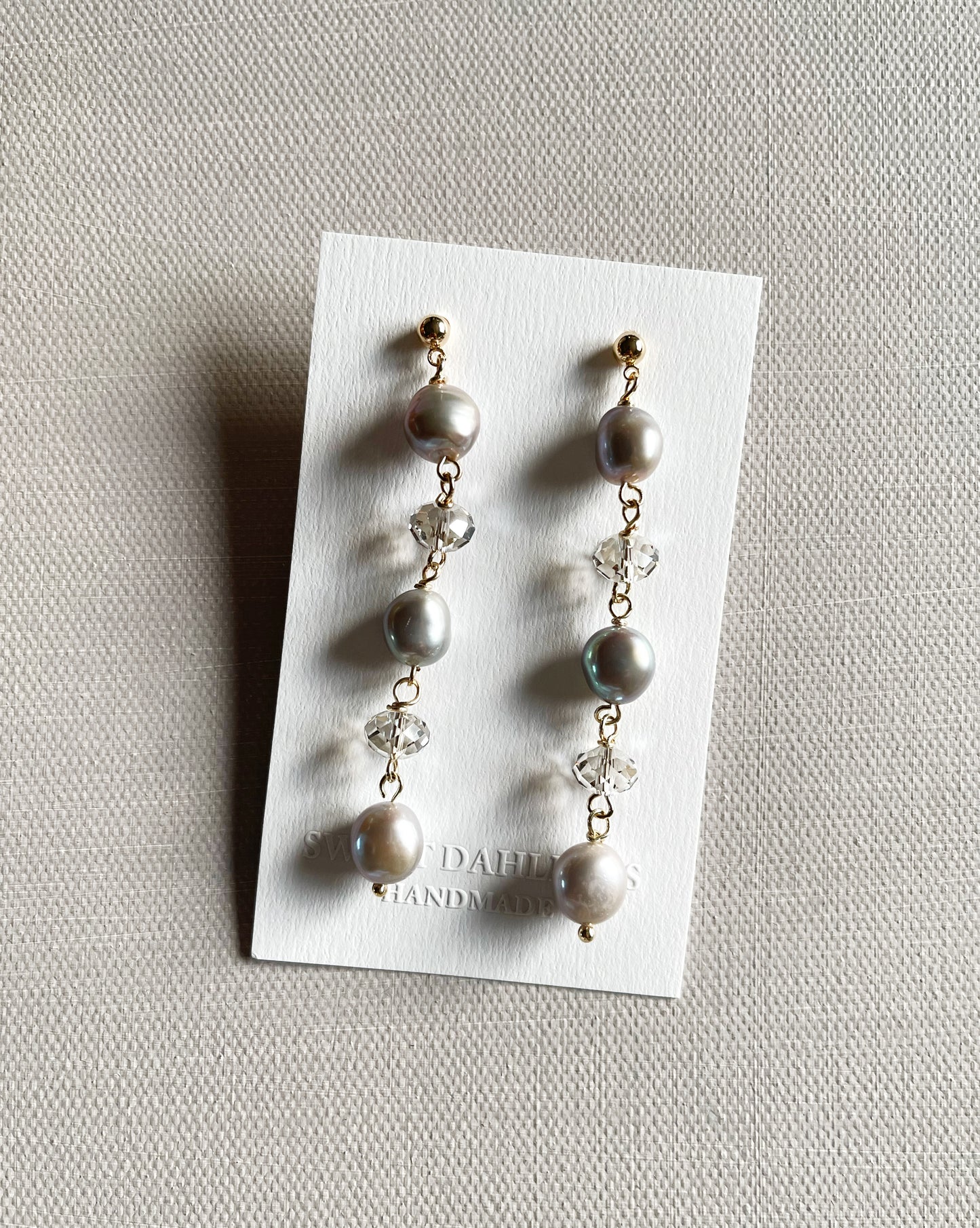 The chandelier earrings in grey freshwater pearls