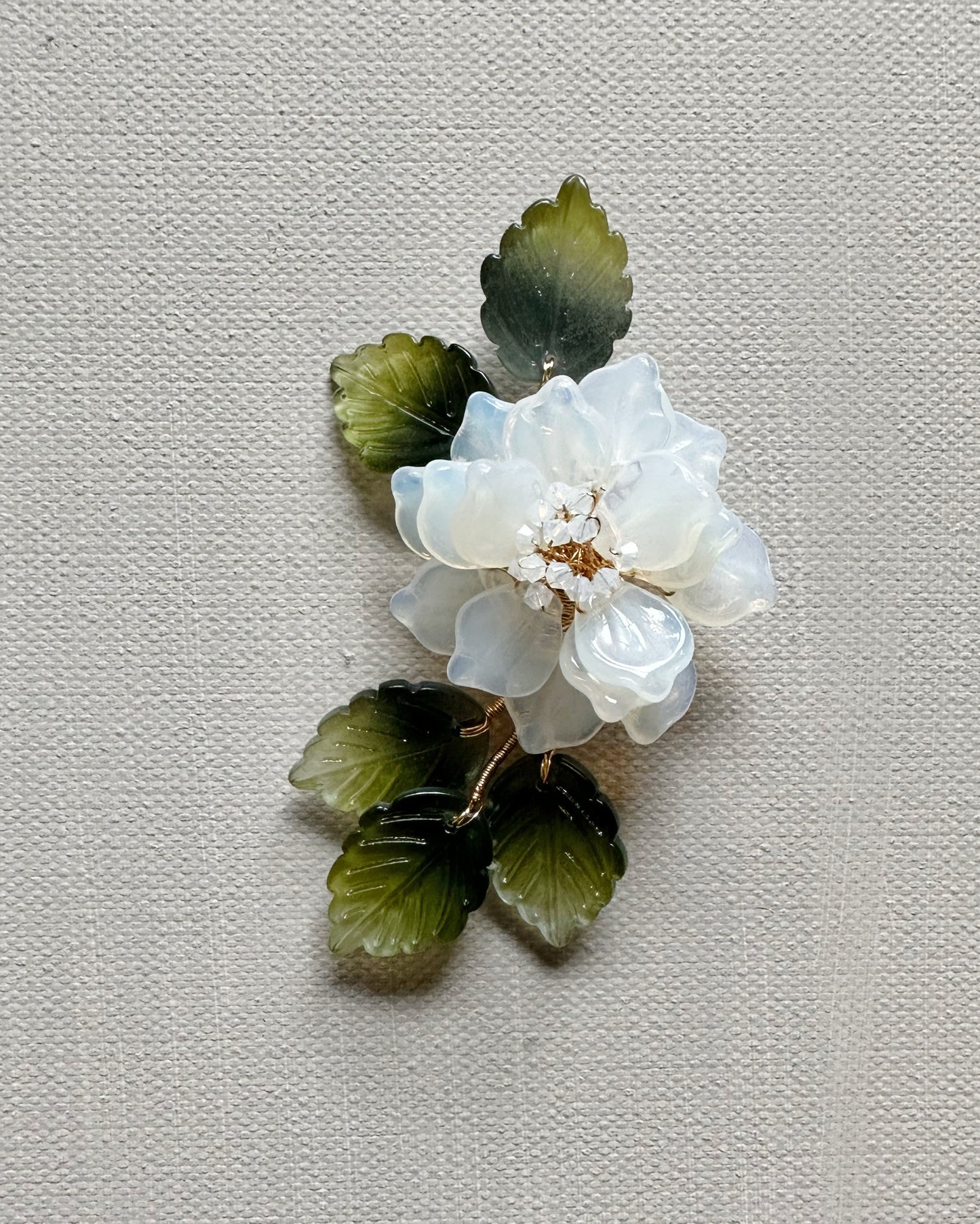 The new peony collar brooch in milky white