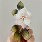 The new peony collar brooch in milky white