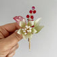 Forever green lily and red blossoms brooch