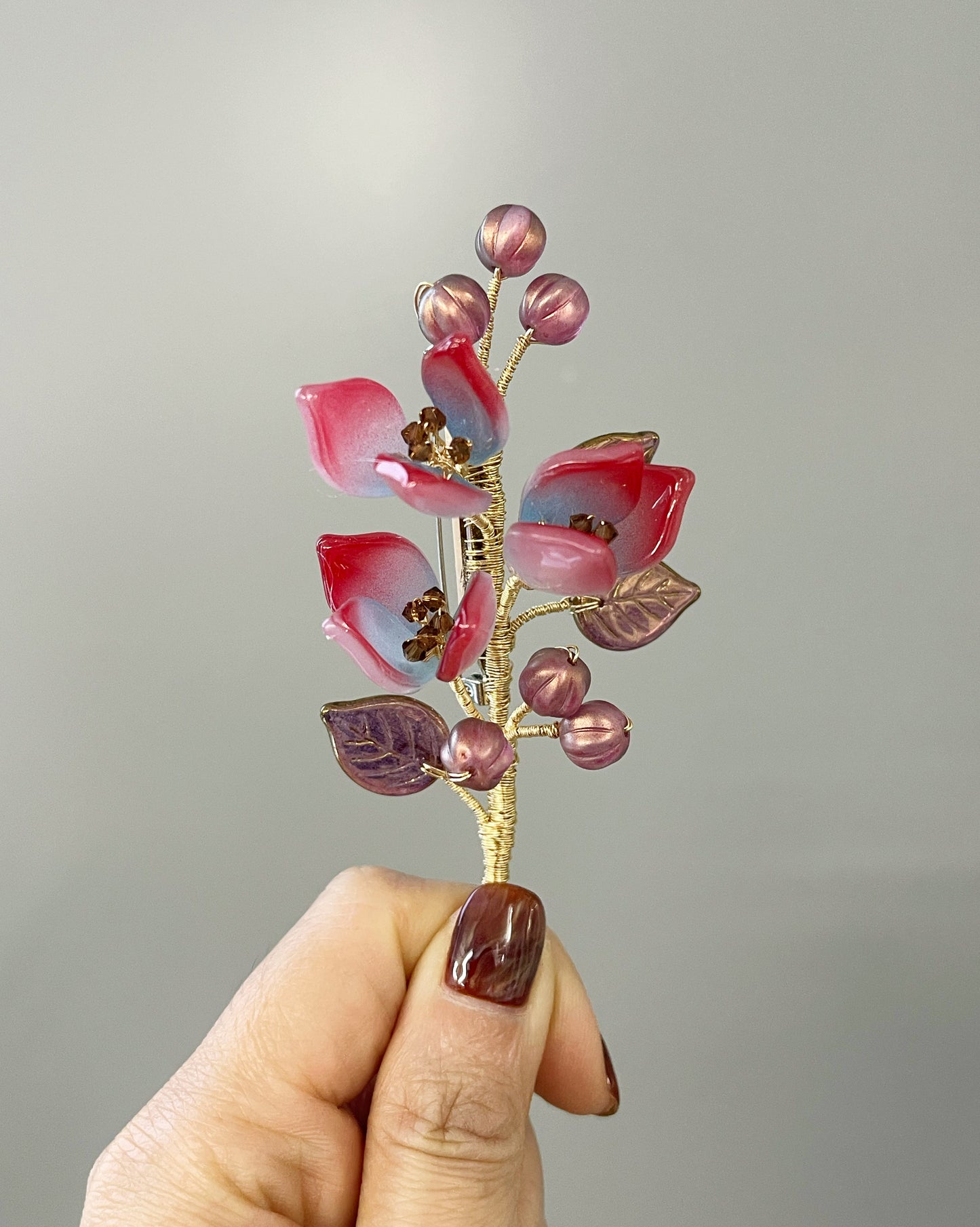 Autumn sunrise in lily buds and berries brooch