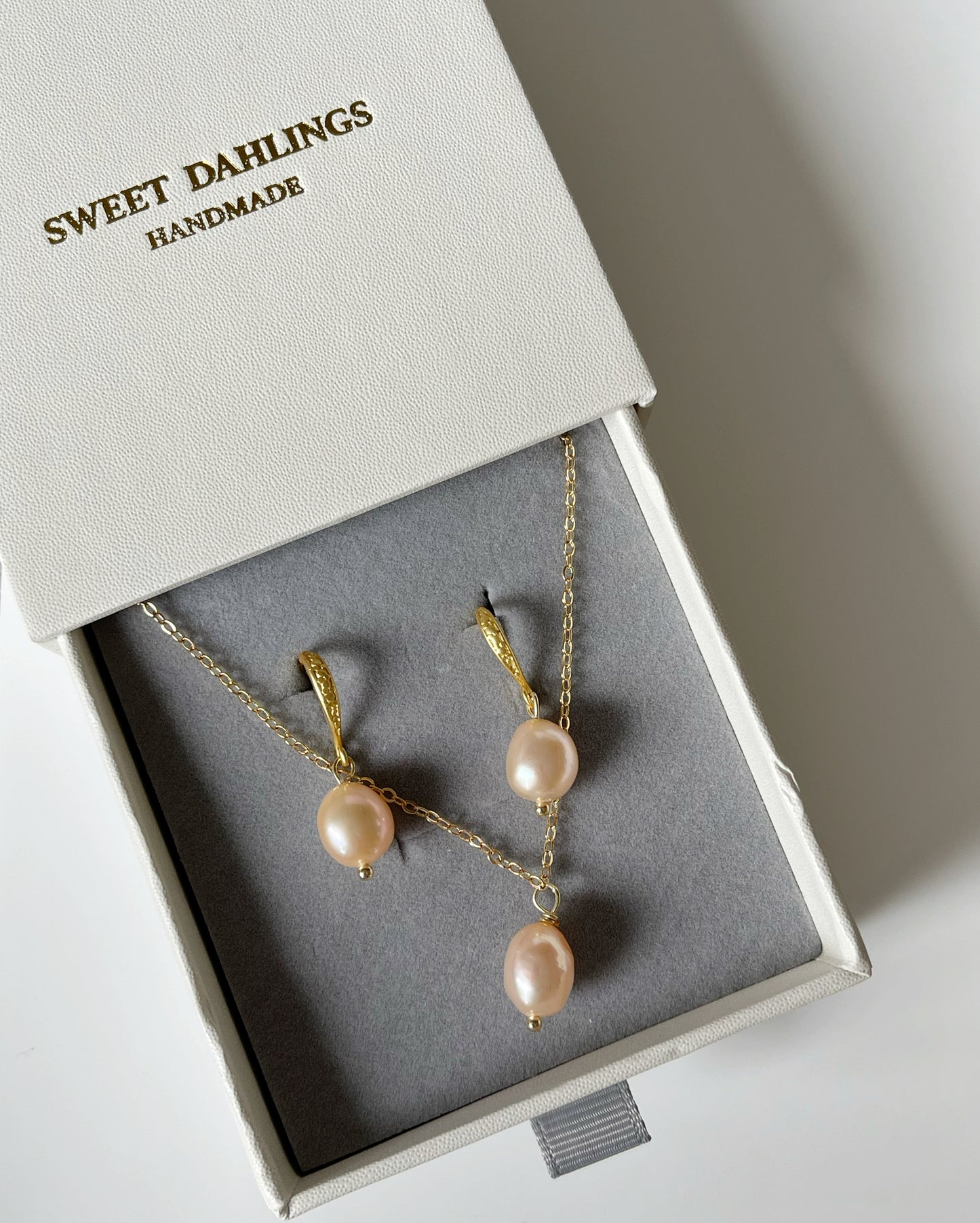 My first baroque pearl necklace and earring set in peachy pink