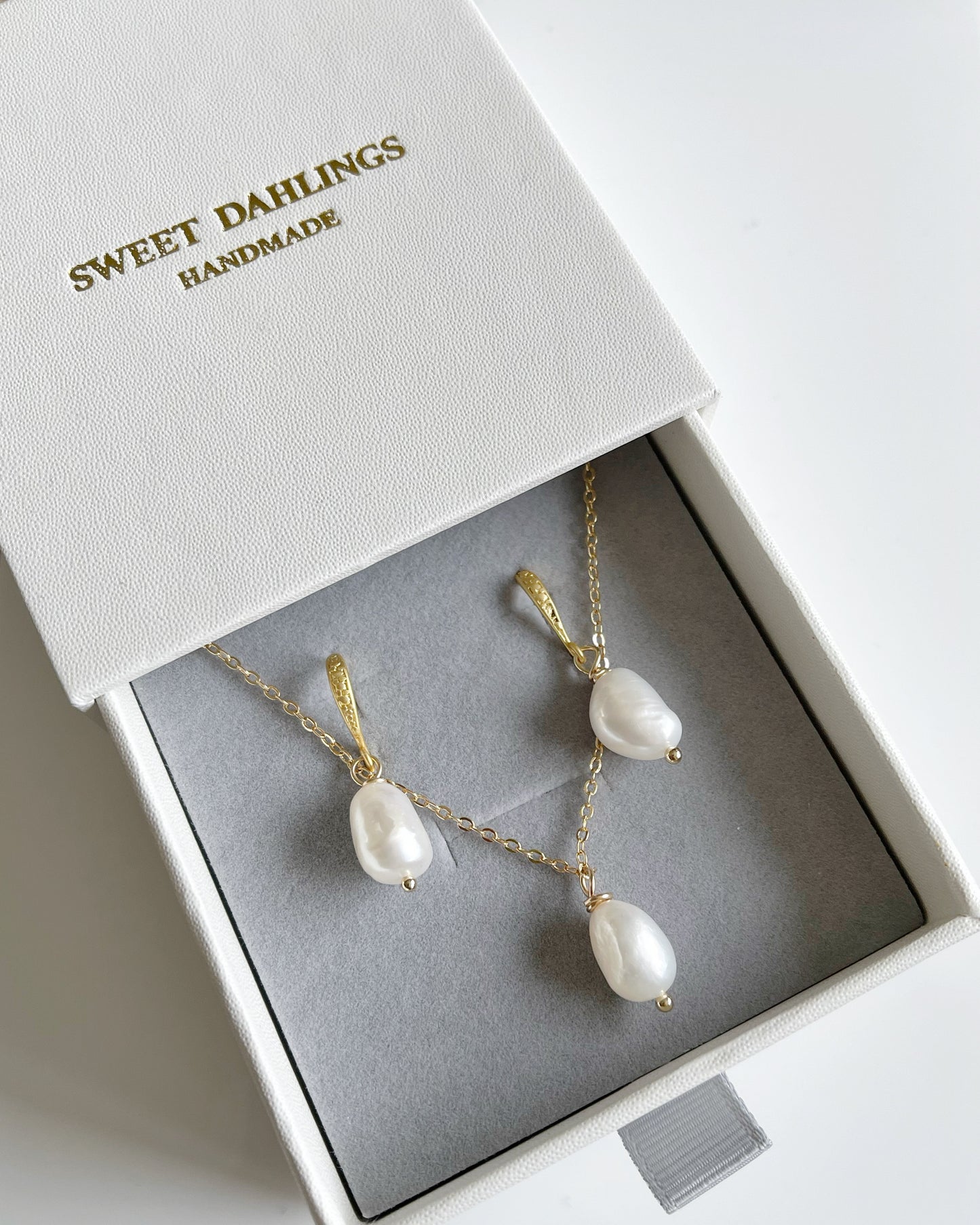 My first baroque pearl necklace and earring set in white
