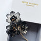 《The Sisters》Festive floral brooch in black