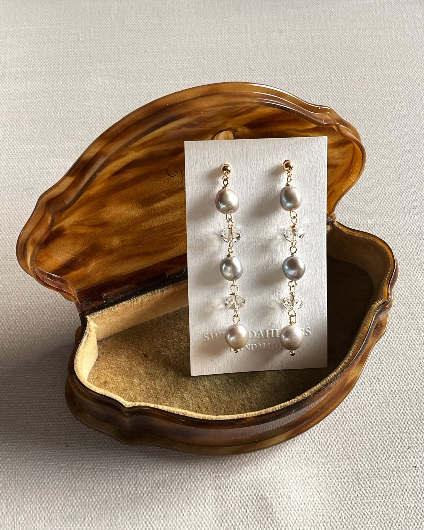 The chandelier earrings in grey freshwater pearls