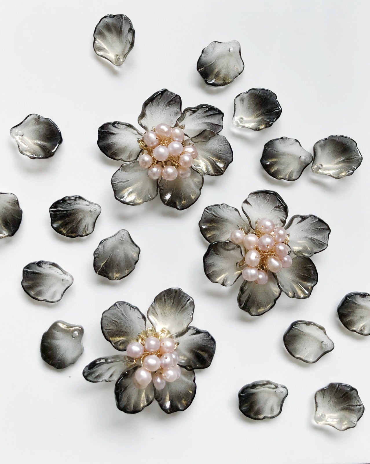 The Sisters glass and freshwater pearls floral brooch in black