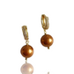 Big pearl huggies in Swarovski crystal bronze pearls
