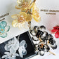 《The Sisters》Festive floral brooch in black