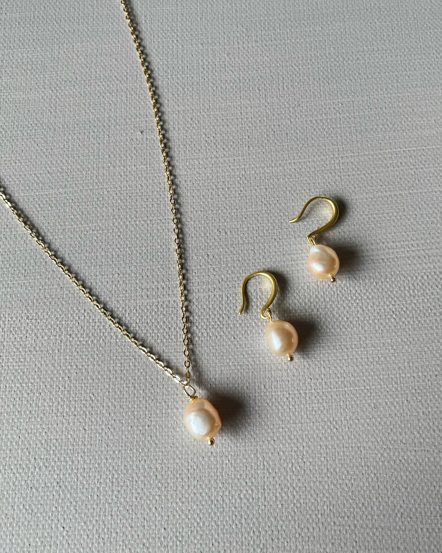 My first baroque pearl necklace and earring set in peachy pink
