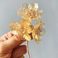 《The Sisters》Festive floral brooch in gold