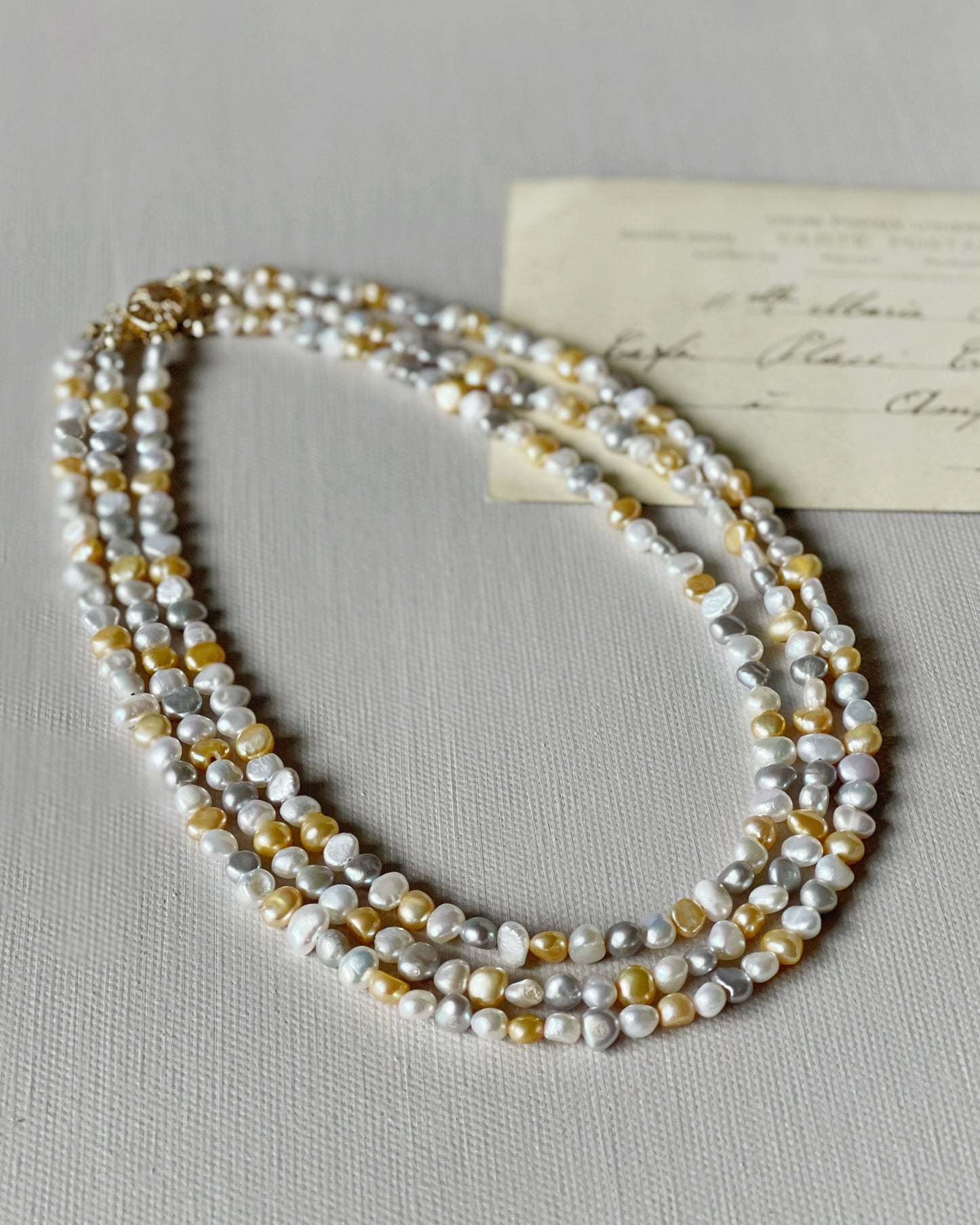 Three-strand coloured freshwater pearls necklace