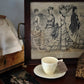 Antique English ceramic embossed floral demitasse and saucer